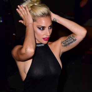 Lady Gaga boobs in see through dress while adjusting hair