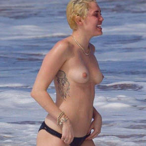 Miley Cyris on beach no bra