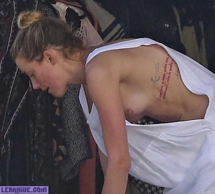 Amber Heard pillada en topless en la playa 1